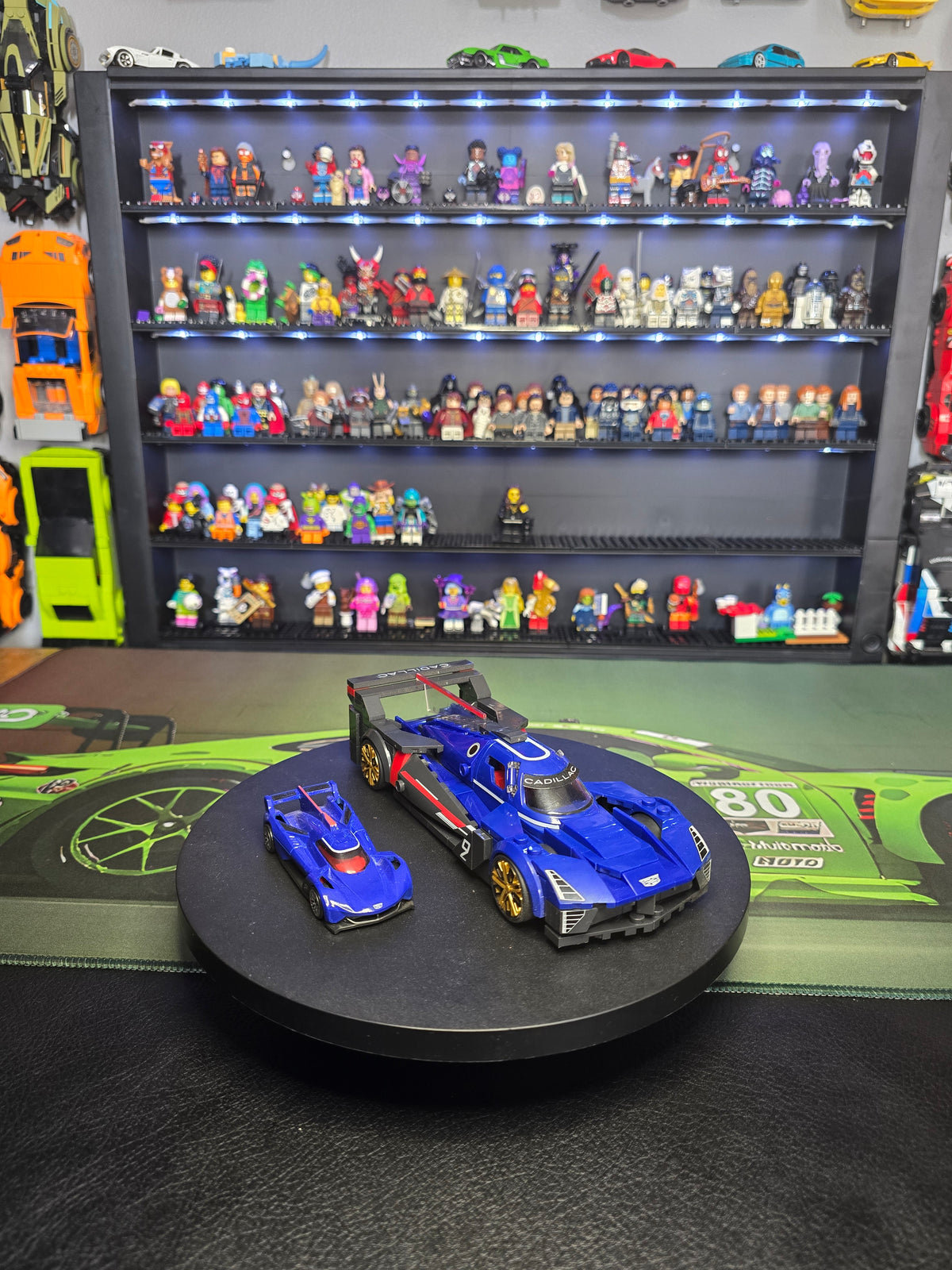 Front three-quarter view of both blue Cadillac Project GTP models