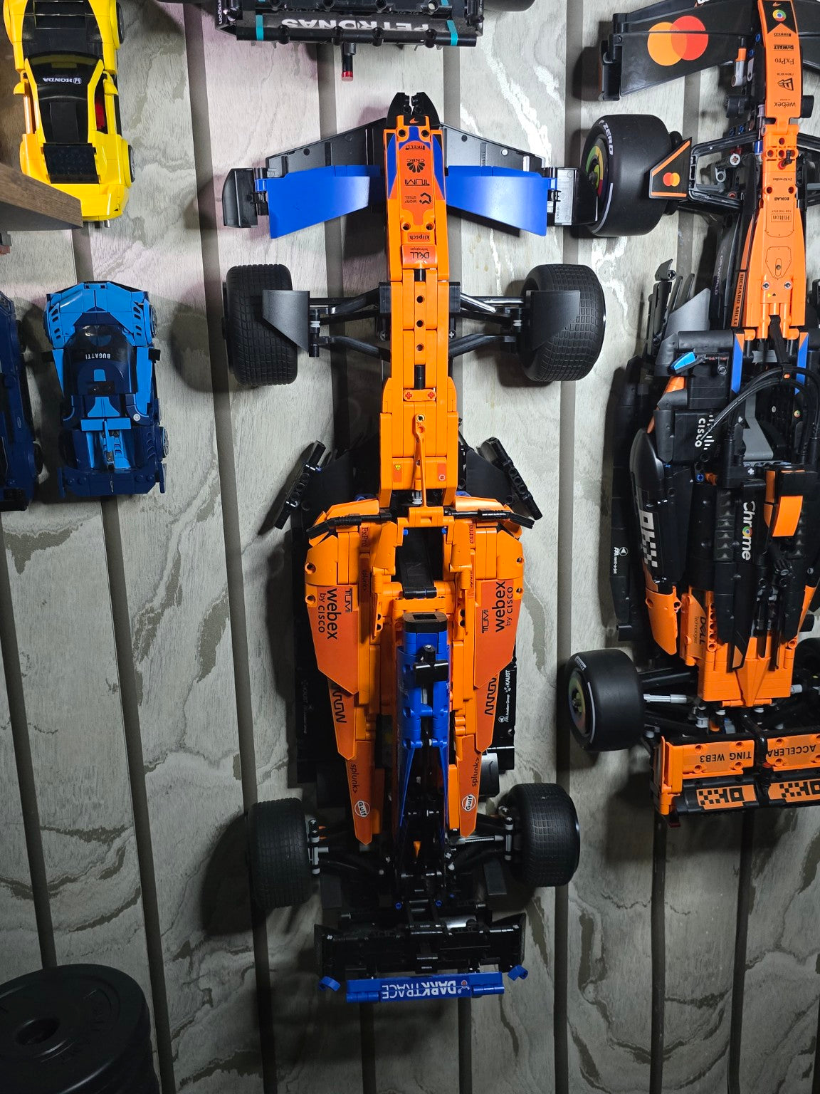 BrickVivid McLaren F1 race car displayed with Bricks & Giggles large car collection