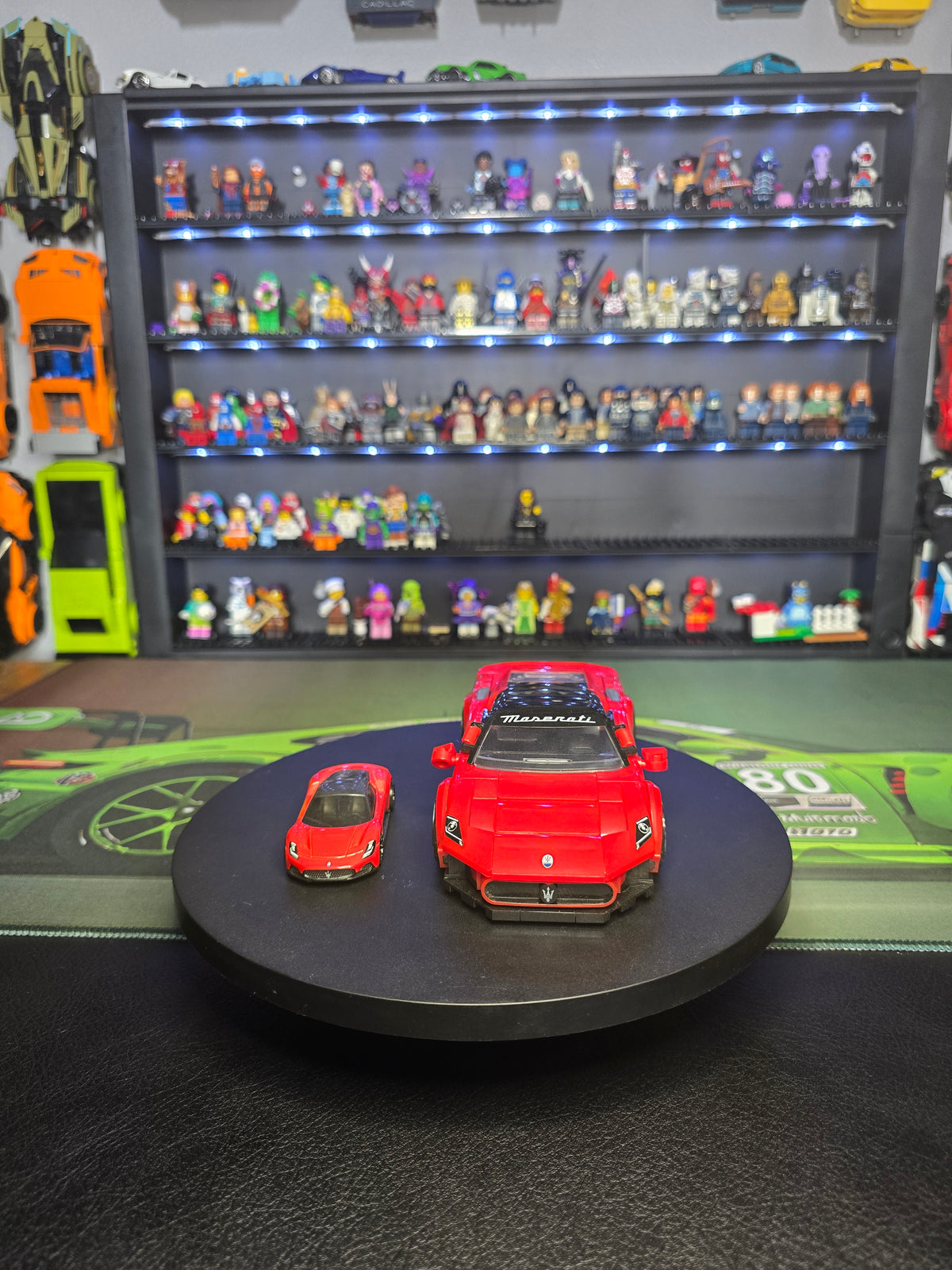Front view of the red Maserati MC20 and matching die-cast car