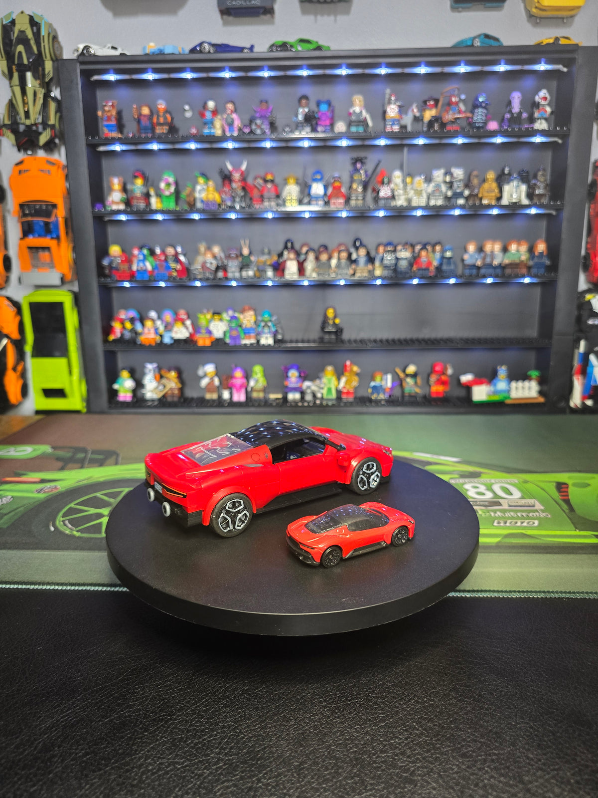 Rear three-quarter view of the Maserati and die-cast car