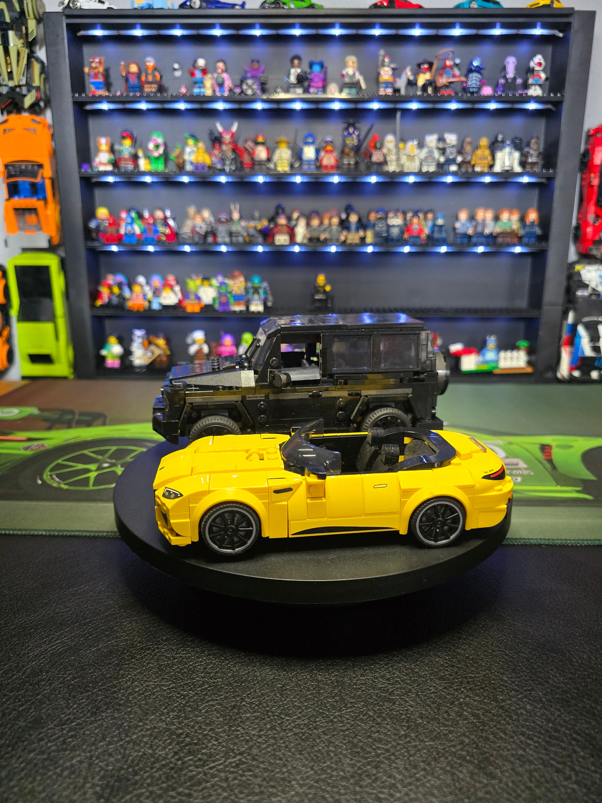 Yellow LEGO Mercedes-AMG SL 63 on a display turntable