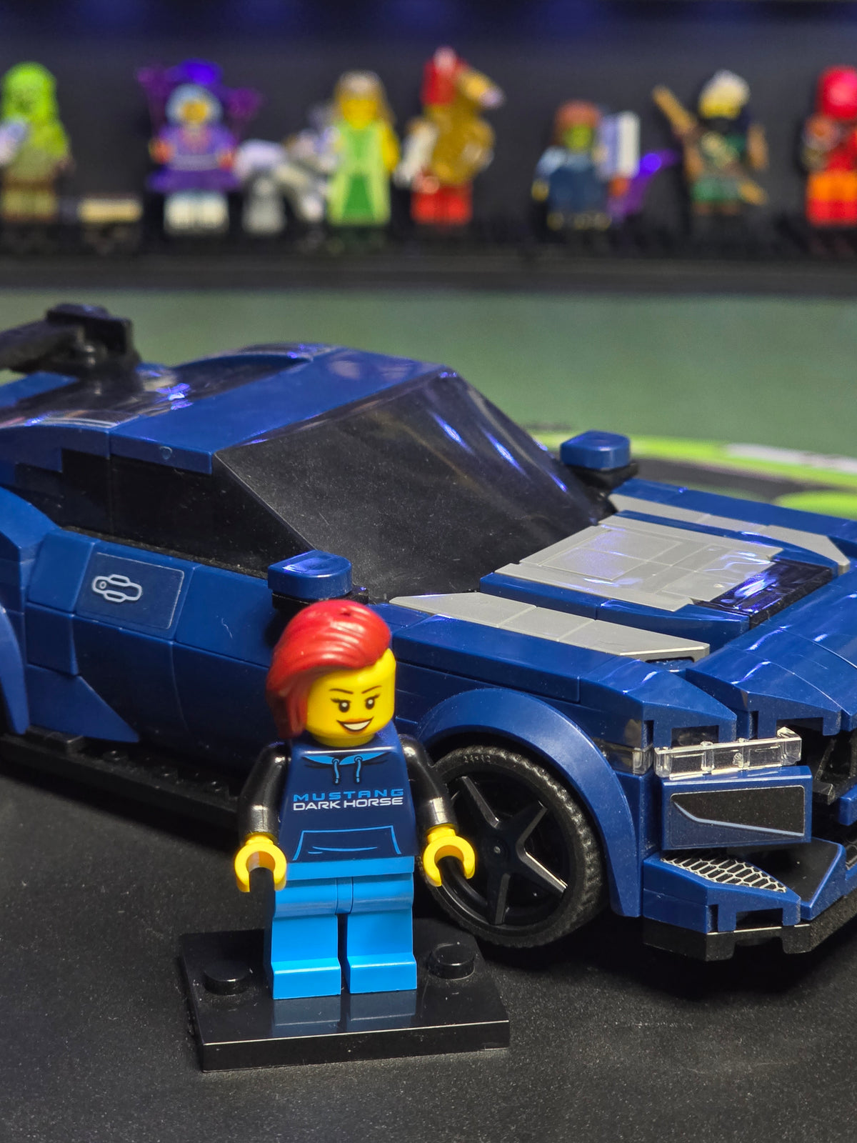 Close-up of the blue Mustang Dark Horse and driver figure