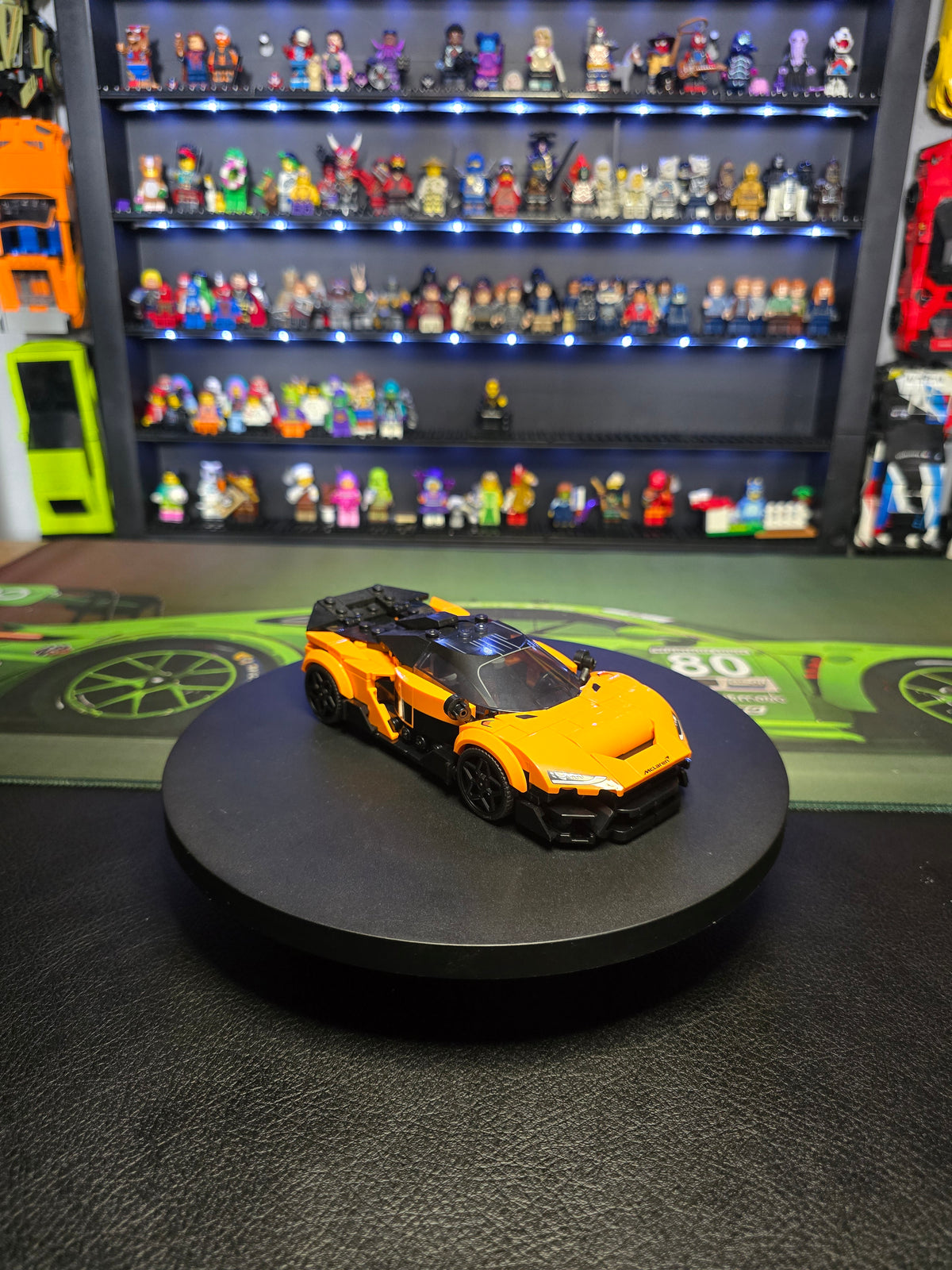 Side view showing the orange and black McLaren bodywork