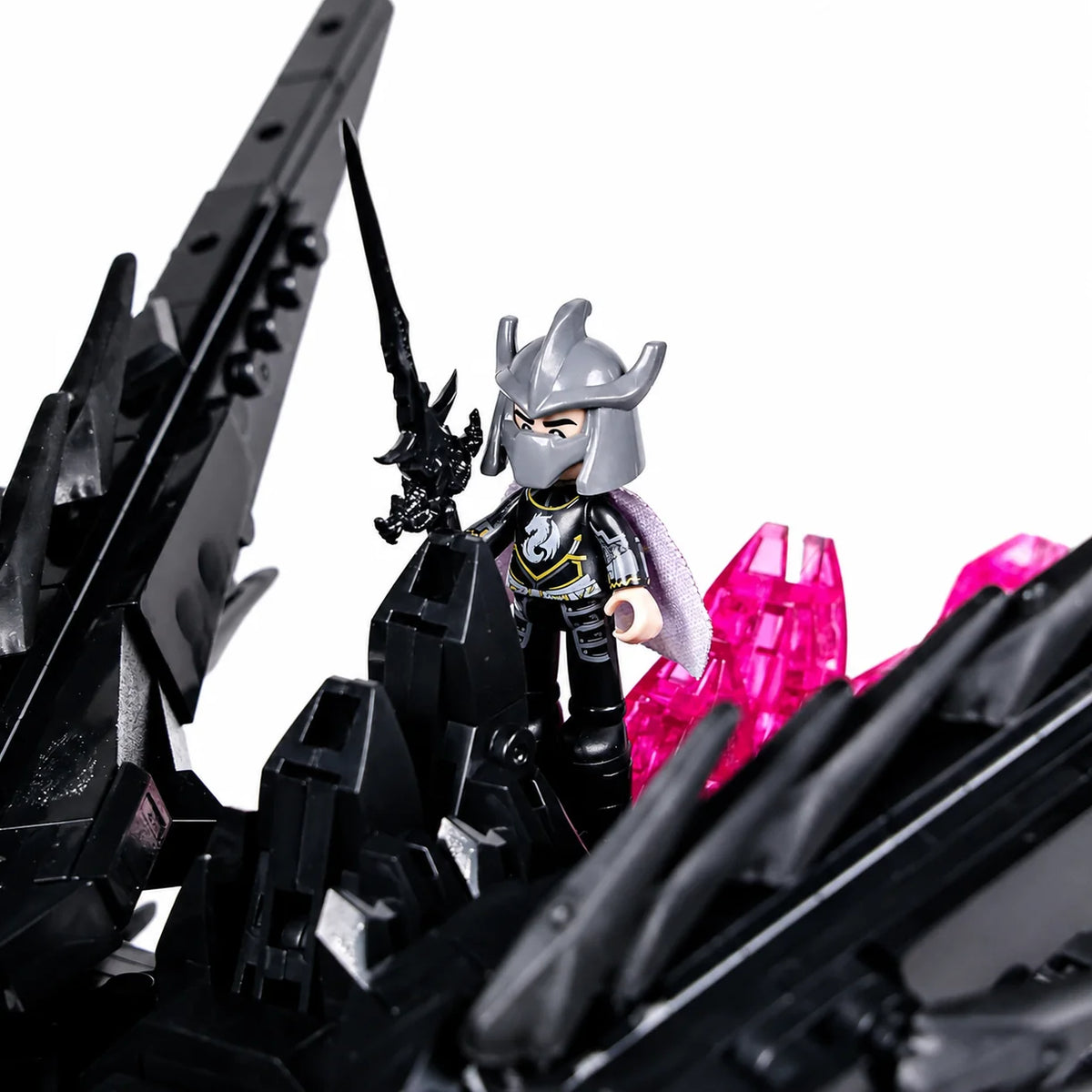 Rider figure seated between the Shadow Dragon wings
