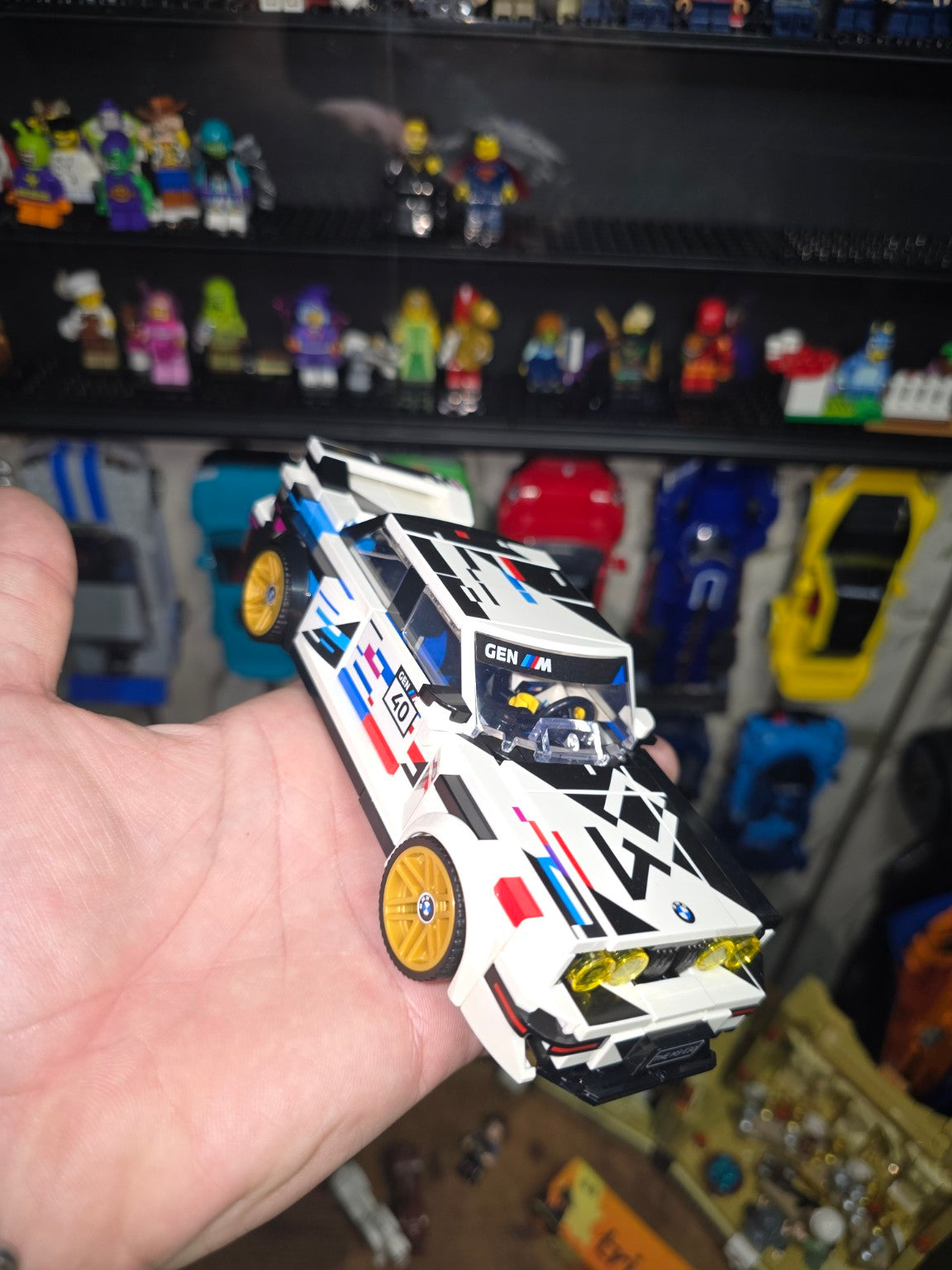Built LEGO Speed Champions BMW M3 E30 held in hand, front three-quarter view