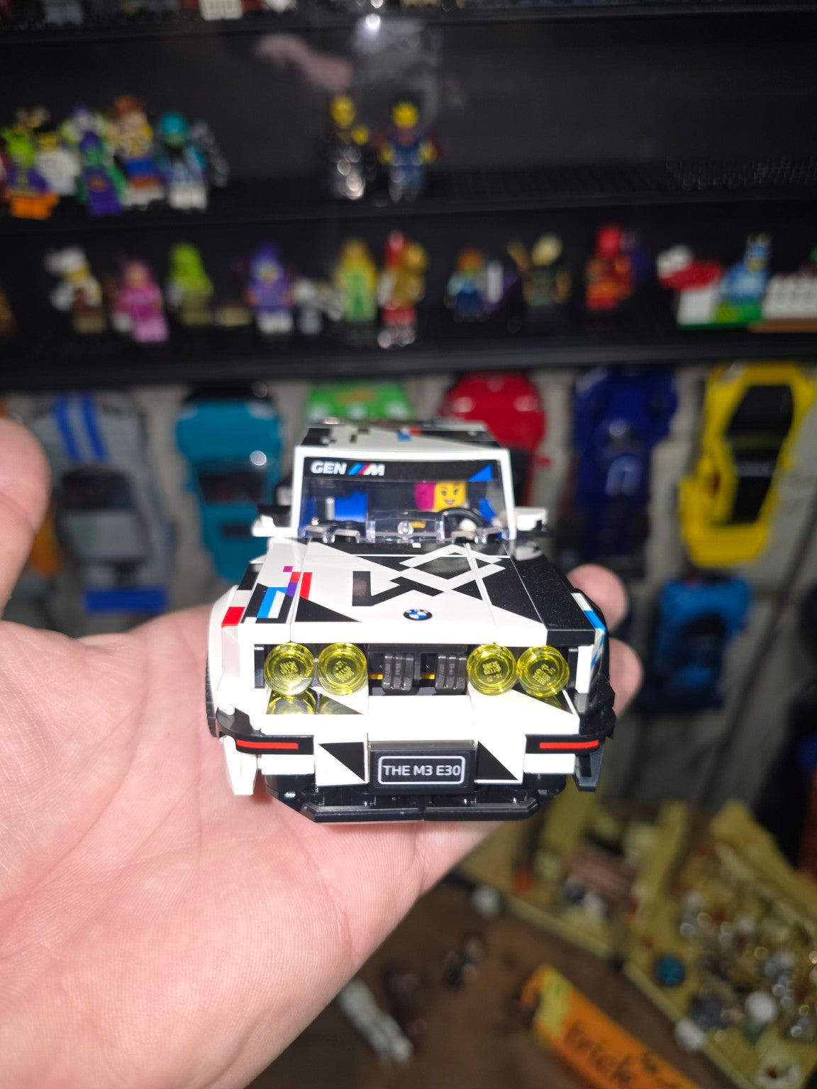 Built LEGO Speed Champions BMW M3 E30 held in hand, front view