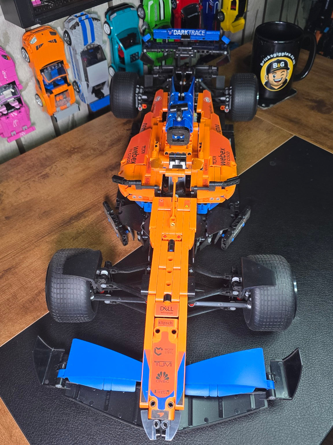 BrickVivid McLaren F1 race car build top view showing orange and blue bodywork