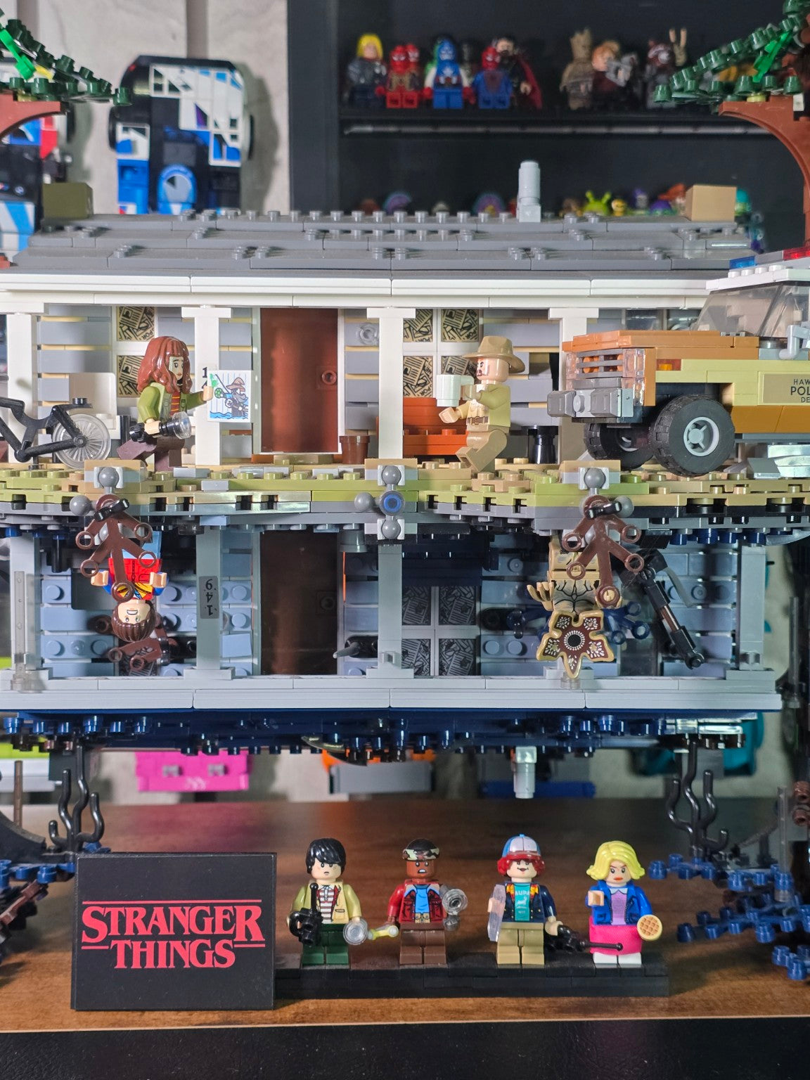 Front view of the finished Stranger Things Upside Down build with figures and Hawkins Police vehicle