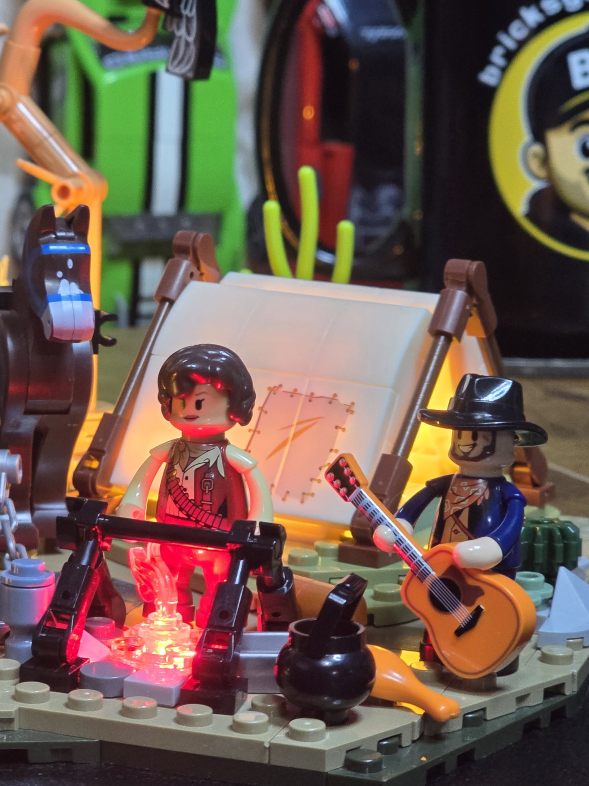 Close-up of the illuminated campfire and figures in the LumiBricks Cowboy Camp