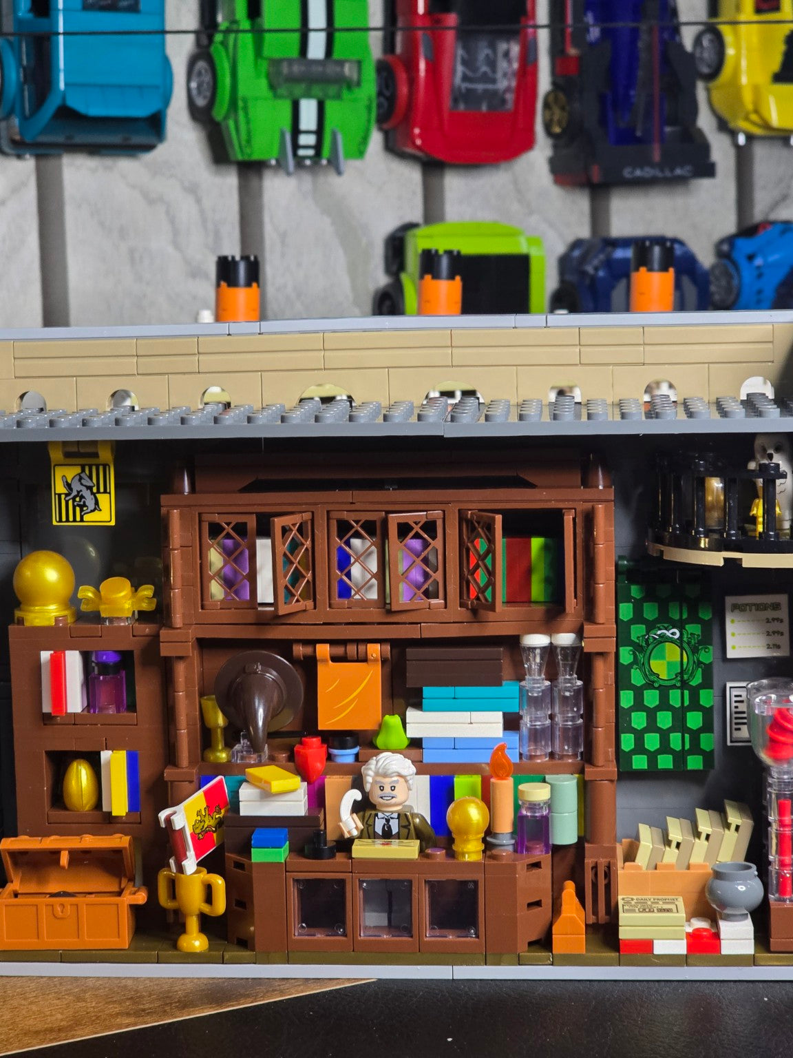 Completed Tokmoc Diagon Alley storefronts opened to show both interior levels