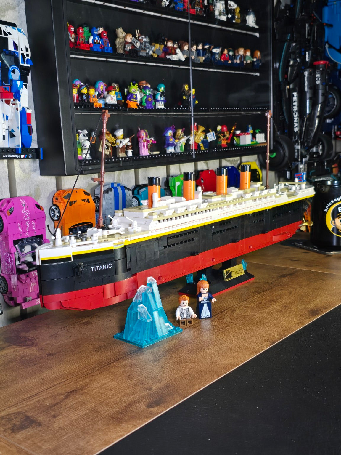 Finished Tokmoc Titanic displayed on the Bricks & Giggles build desk with iceberg and figures
